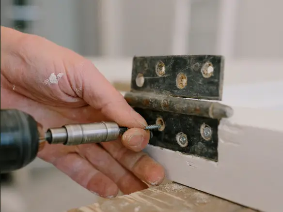 repair to door hinge
